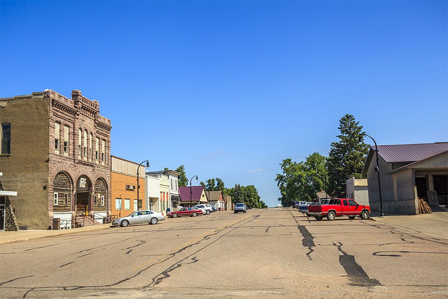 Victor IA - View of Commercial Buildings and Parked Cars Along the Main Street in Downtown Victor Iowa